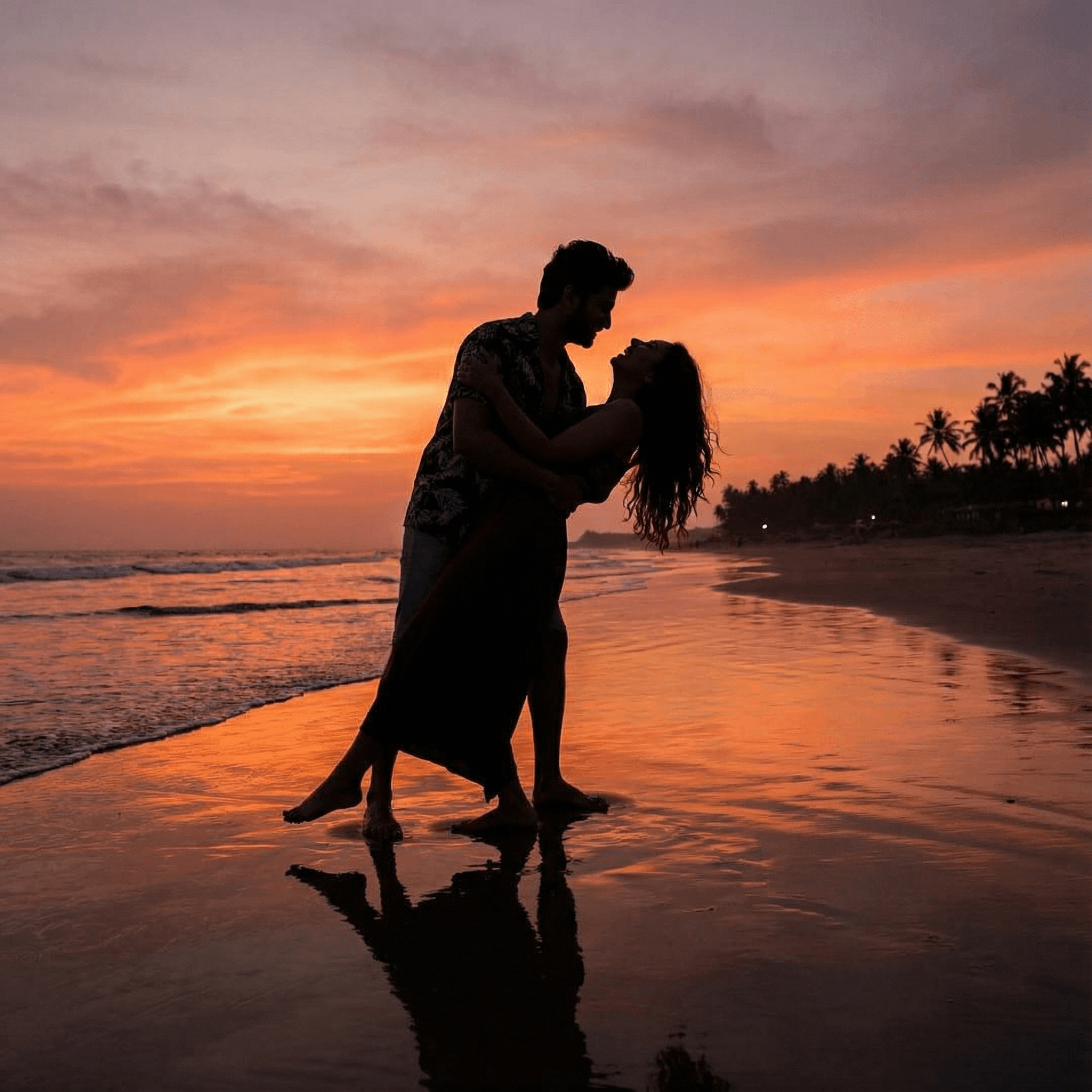 A silhouette shot of an Indian couple embracing on a vast beach at sunset. The man is dipping the girl slightly, and she is looking up at him, laughing. The dramatic colors of the sunset reflect on the wet sand, creating a highly romantic and cinematic backdrop for their affectionate pose.