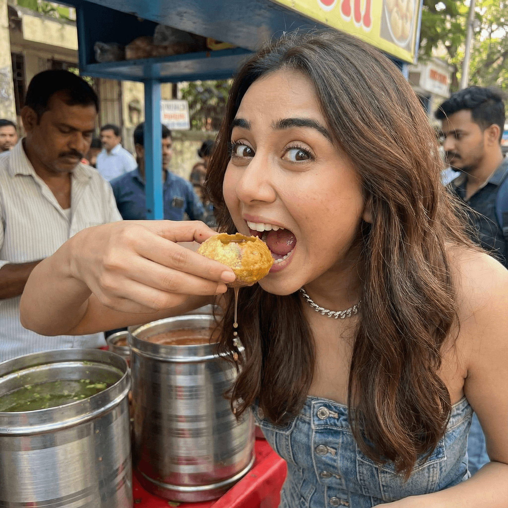 A girl standing at a Pani Puri stall, mouth wide open, about to eat a massive Golgappa. Expression Cue: Eyes popping out in fear of the size, but laughing. A look of "Can I fit this?" pure foodie fun.